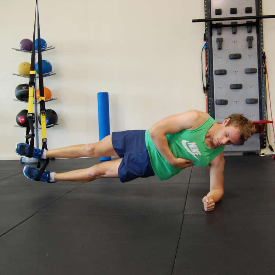 Man performing TRX Side Plank
