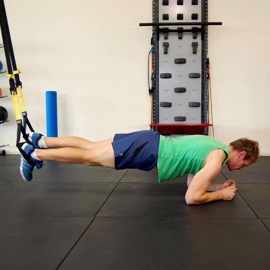 Man performing the TRX body saw