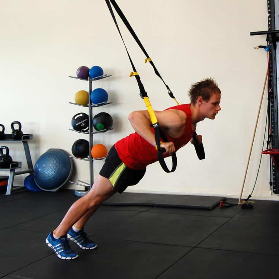 Man performing the TRX chest press