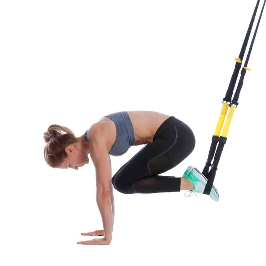 Girl performing TRX Crunch