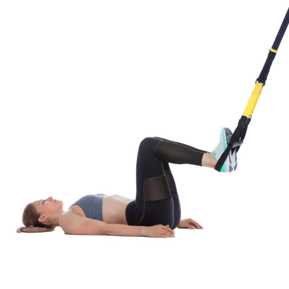 Girl Performing a TRX Hip Thrust
