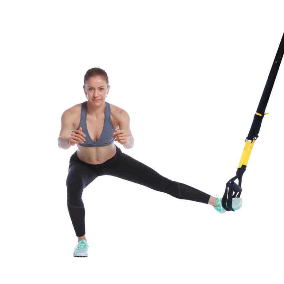 Girl Performing TRX Lateral Squat
