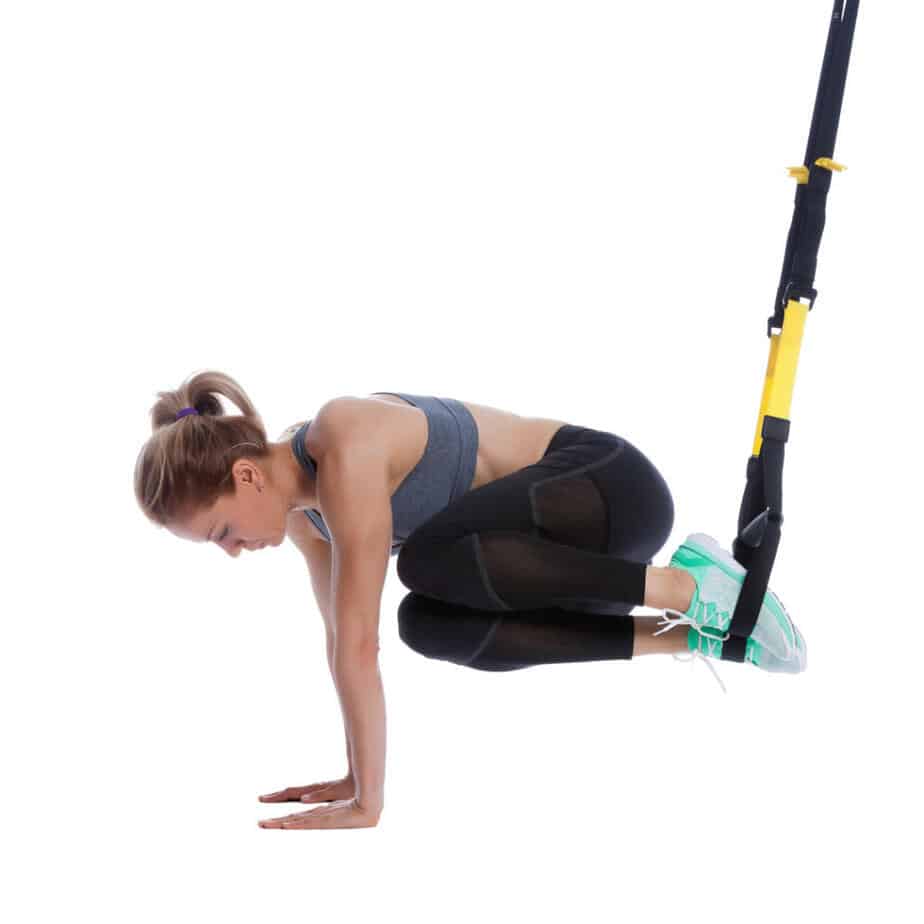 Girl Performing TRX Oblique Crunch