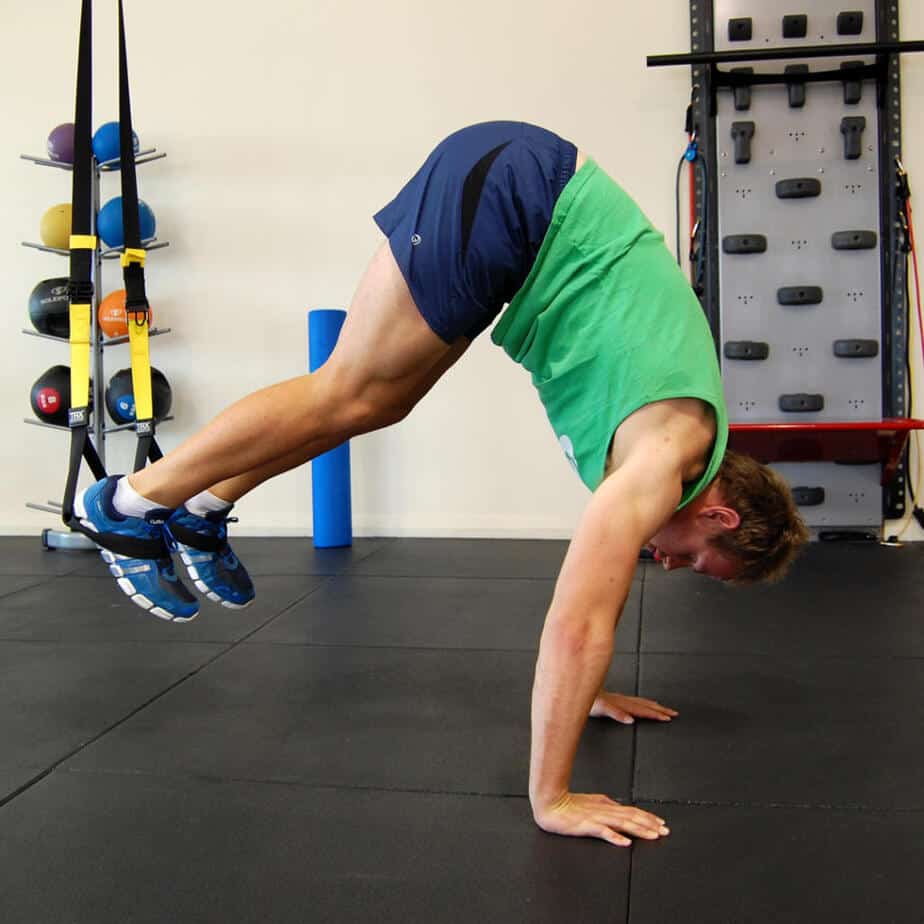Man performing the TRX Pike