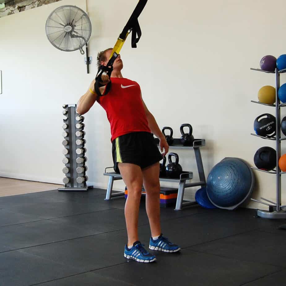 Man performing the TRX single arm row