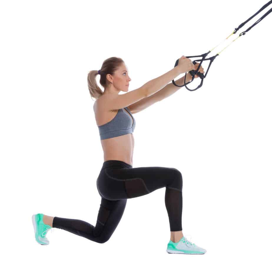 Girl performing a TRX Step Back Lunge