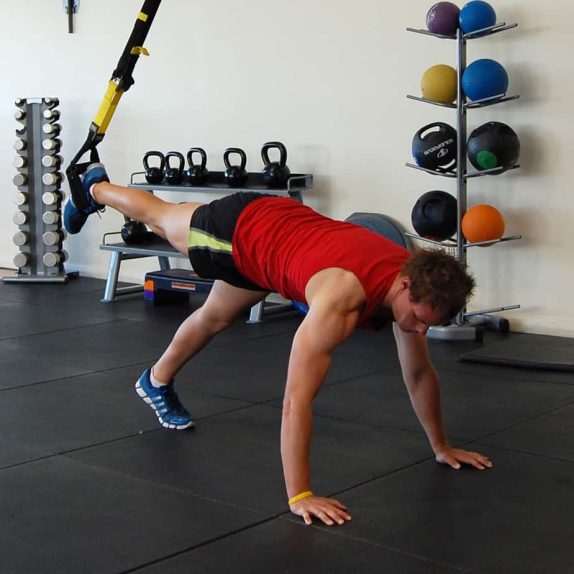 Man performing the TRX assisted push up