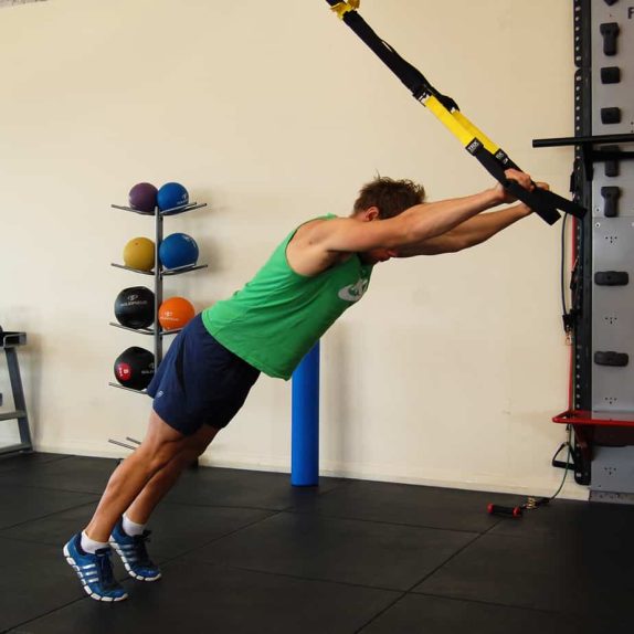 Man performing a TRX superman